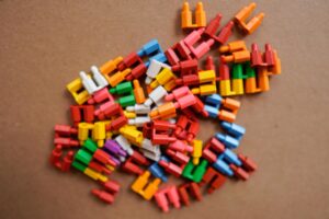 A vibrant collection of colorful plastic toy blocks scattered on a surface.